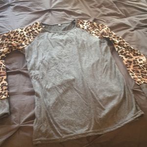 Never worn top with leapord sleeves